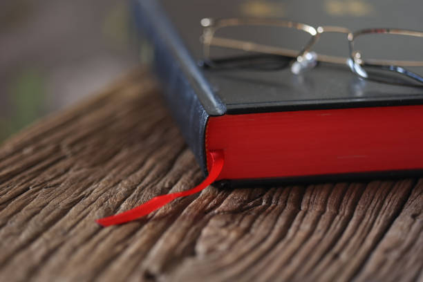 istock Open Holy Bible on a old wooden table 1439391939