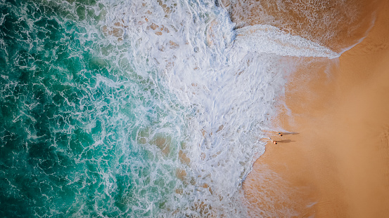Drone point of view on Dreamland beach, Bali, Indonesia.