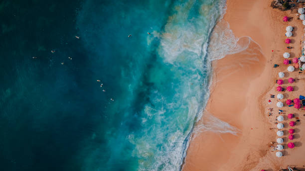 istock Aerial view of beach waves splashing on the sandy beach 1439392113