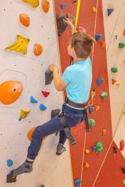 istock Boy is climbing using autobelay at indoor climbing hall 1439392193