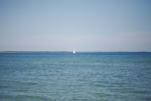 A white sailboat on Lake Ontario in Canada