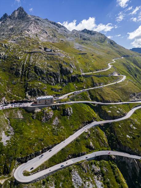Drone shot of Swiss Mountain Roads, The Furka Pass and Susten Pass next to the Rhone Glacier A drone shot of Swiss Mountain Roads, The Furka Pass and Susten Pass next to the Rhone Glacier furka pass photos stock pictures, royalty-free photos & images