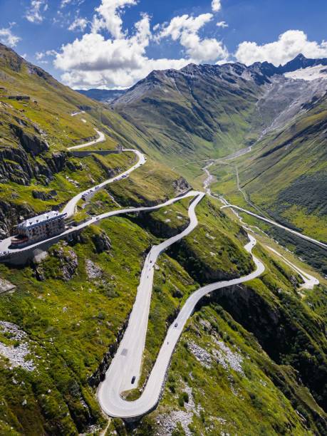 Drone shot of Swiss Mountain Roads, The Furka Pass and Susten Pass next to the Rhone Glacier A drone shot of Swiss Mountain Roads, The Furka Pass and Susten Pass next to the Rhone Glacier furka pass photos stock pictures, royalty-free photos & images