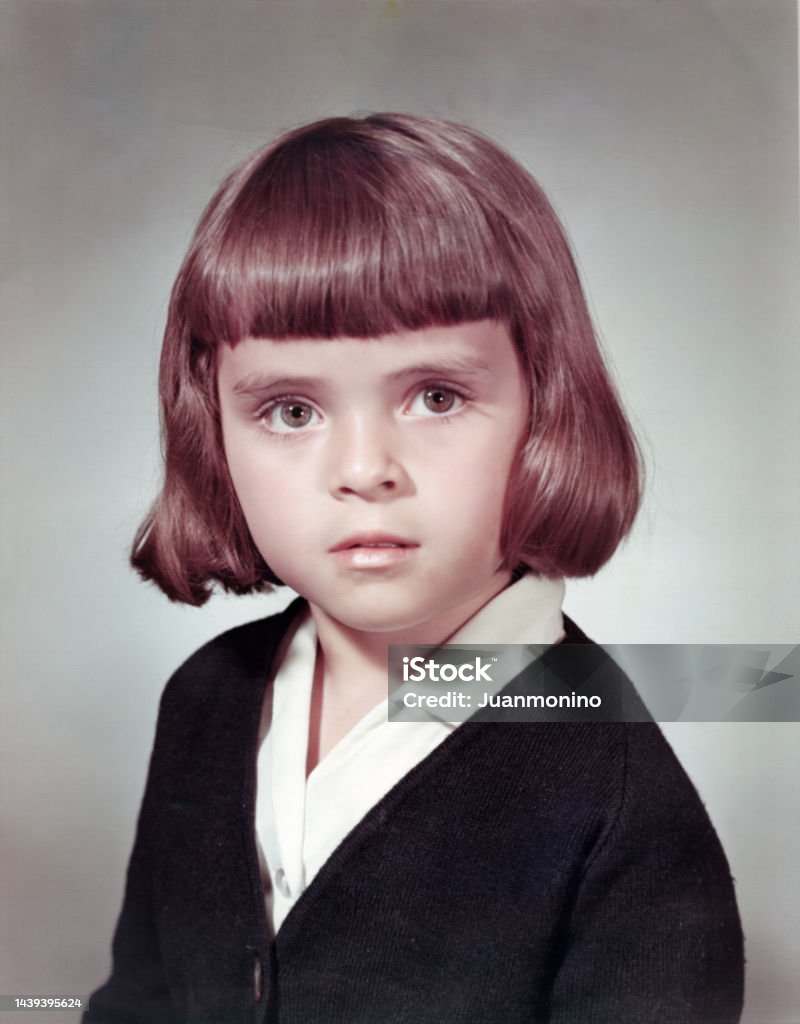 Image taken in the 60s: Studio headshot of a schoolgirl Retro Style Stock Photo