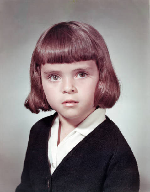 Image taken in the 60s: Studio headshot of a schoolgirl stock photo
