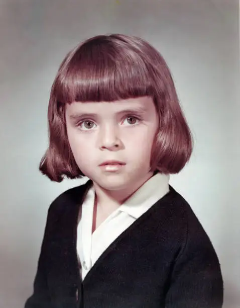 Image taken in the 60s: Studio headshot of a schoolgirl