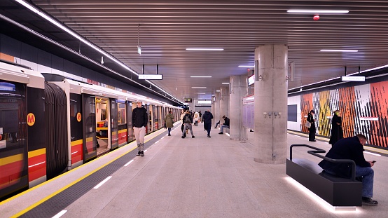 London, UK - 25 August, 2022: blurred motion of a subway train as it departs the modern architecture of the newly built Battersea Power Station underground station on the London Underground network.