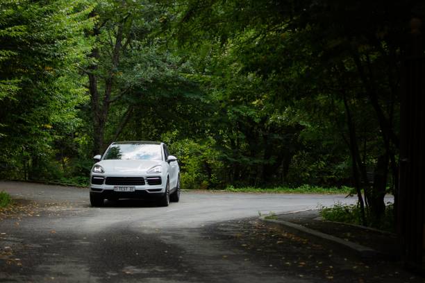 Yereva, Armenia – August 01, 2020: A white Porsche cayenne on a road during a presentation in Armenia