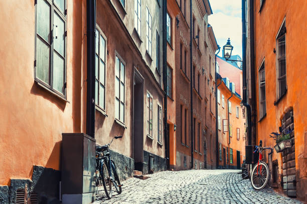 Street with old colorful buildings in Old Town district in Stockholm, Sweden stock photo