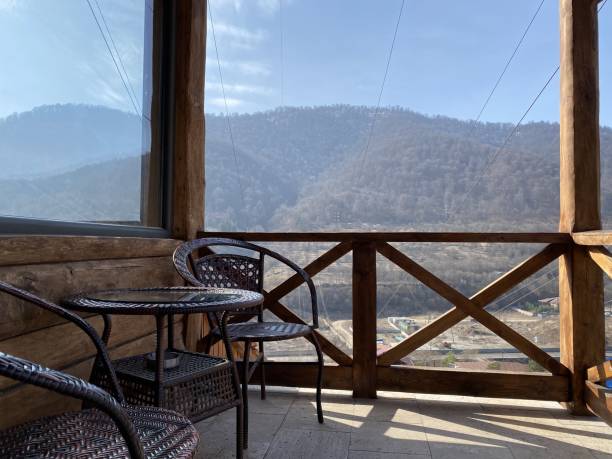 istock Small dining area for two at a balcony with a mountain view 1439409485
