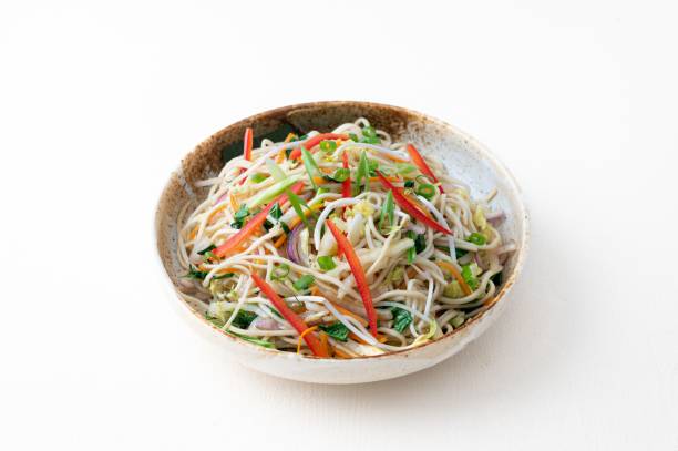 istock Noodles made with vegetables and onions on a white background 1439409561