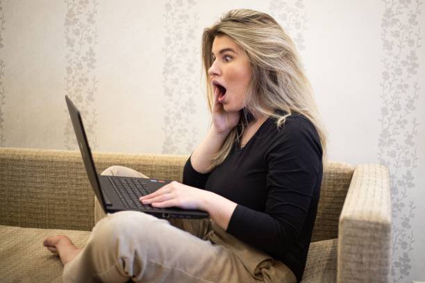 istock Female looking at the laptop with a surprised face 1439409979