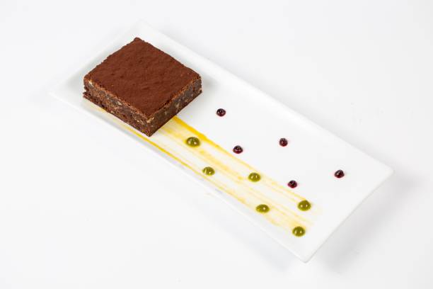 istock Appetizing chocolate brownie in plate on a white background 1439413810