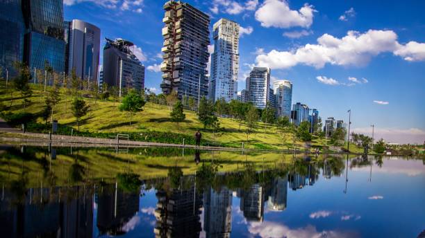 istock Skyscrapers surrounded by trees and the water 1439416734