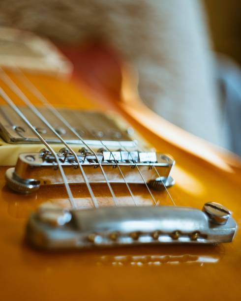 istock Closeup vertical shot of a brown electronic guitar 1439418391