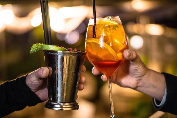istock People drinking cocktail together with blurred background 1439419036