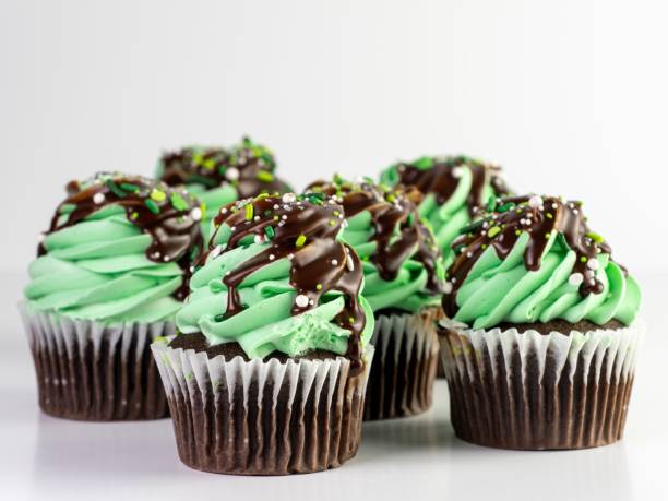 istock Closeup of mint chocolate cupcakes against a grey background 1439420495