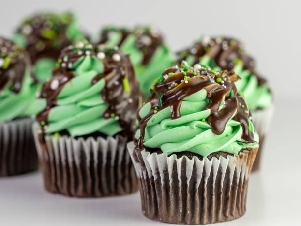 istock Closeup of mint chocolate cupcakes against a grey background 1439420517