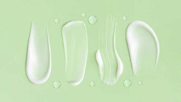 istock cosmetic smears cream texture on pastel green background 1439423270