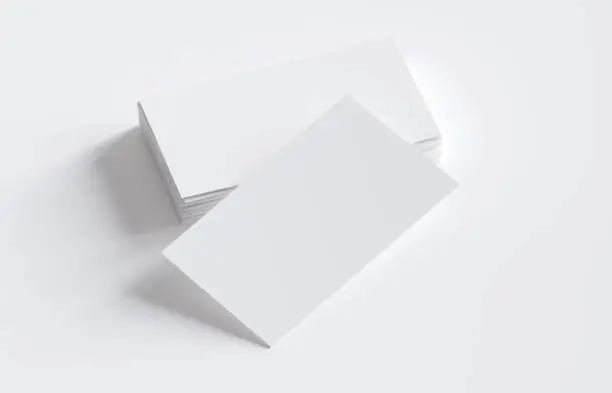 Photo of Stack of blank business cards on white background