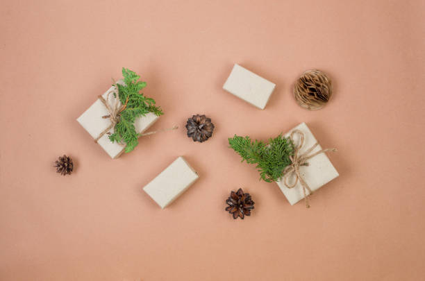 istock Christmas background with gift boxes wrapping in craft paper. 1439425542