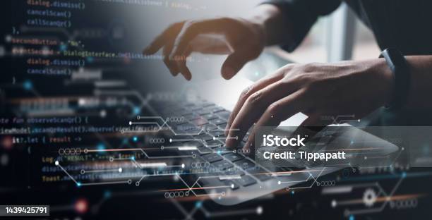 Digital Technology Software Development Concept Coding Programmer Working On Laptop With Circuit Board And Javascript On Virtual Screen Stock Photo - Download Image Now