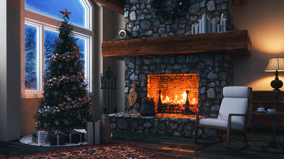 Cozy chalet living room with fireplace and Christmas decoration at night.