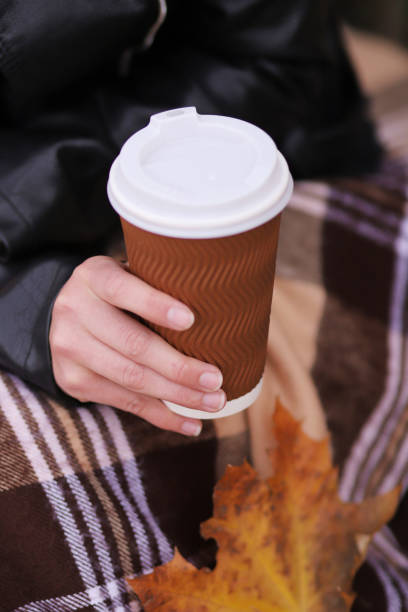 istock cup with coffee and yellow autumn leaves, fall concept 1439439865