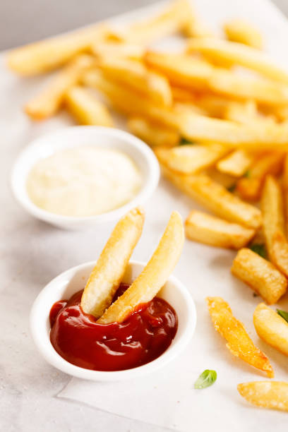 istock Potato fries with mayo and ketchup. 1439440362