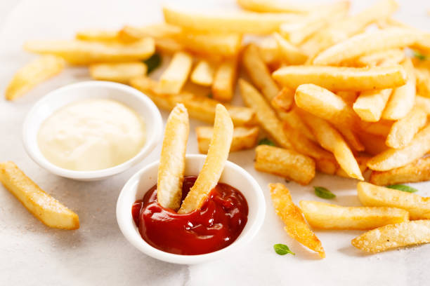 istock Potato fries with mayo and ketchup. 1439440370