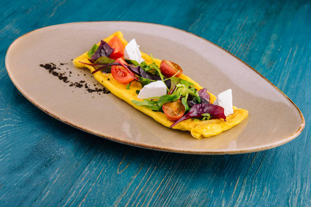 istock Omelette with cherry tomatoes and goat cheese 1439444309
