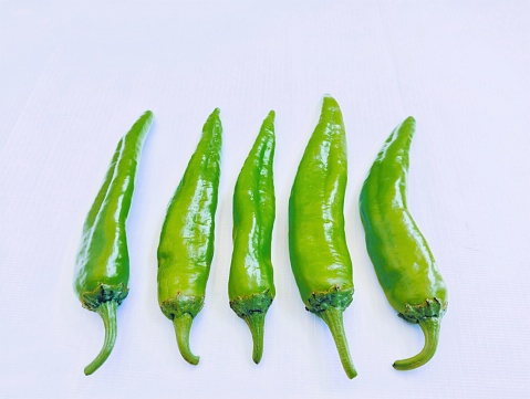 Green chilli chilly pepper hari mirch chillies hareemirach piment vert spicy vegetable ingredient raw shining fresh food closeup view image photo