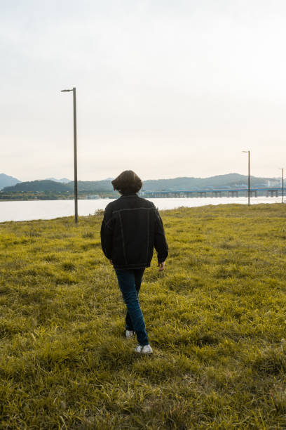 istock Individual Walking In Field 1439448105