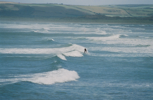 A lone surfer on large waves off the North Devon coast, 35mm