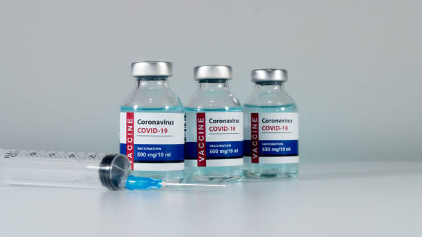 istock Coronavirus vaccine and syringe using prevention, immunization and treatment from coronavirus infection. COVID-19, nCoV 2019. COVID-19 Vaccine Concept 1439448834