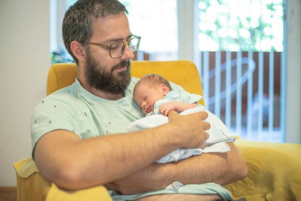 istock Connection between the father and newborn son 1439450435