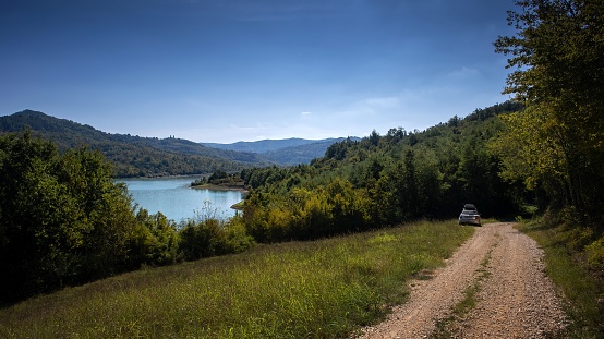 Trail passing by Butniga lake, the biggest lake in Istria.