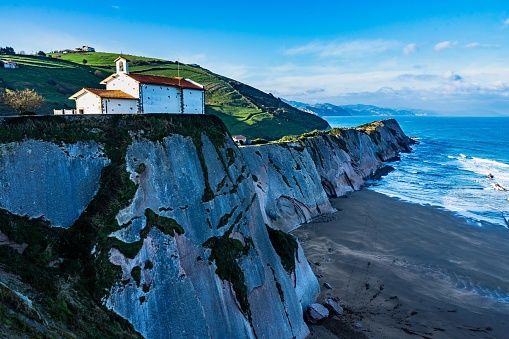The San Telmo chapel on the top of the cliffs overlooking the Atlantic Ocean, Zumaia, Basque Country, Spain