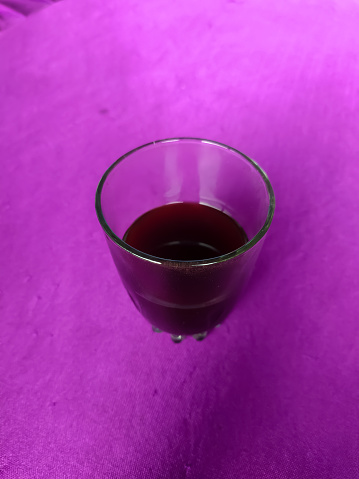 Glass on a purple background.