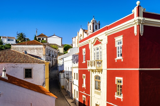 A beautiful view of Silves old town with a narrow road leading to the Cathedral in Algarve, Portugal