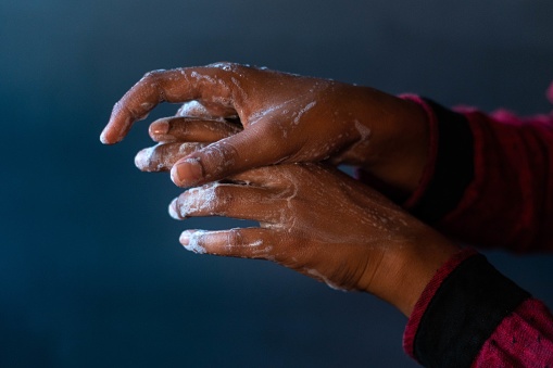 A closeup shot of the soaped hands of a person - importance of washing hands during the coronavirus pandemic