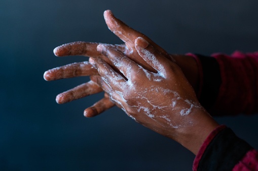 A closeup shot of the soaped hands of a person - importance of washing hands during the coronavirus pandemic