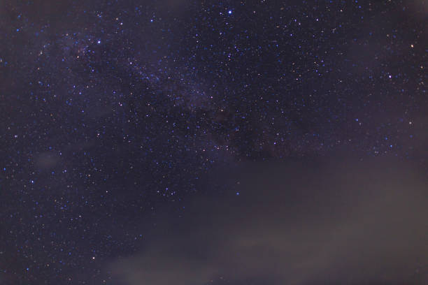 istock Starry sky on the lake. Night landscape. Sky with clouds. 1439455591