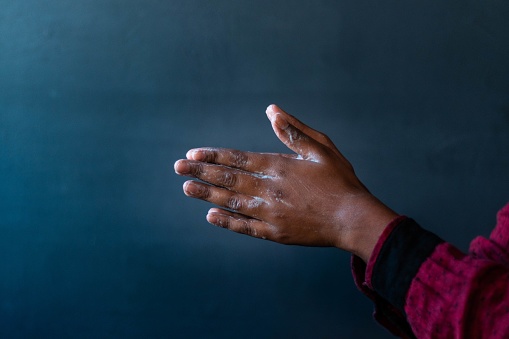 A closeup shot of the soaped hands of a person - importance of washing hands during the coronavirus pandemic