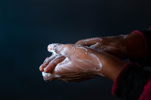 A closeup shot of the soaped hands of a person - importance of washing hands during the coronavirus pandemic