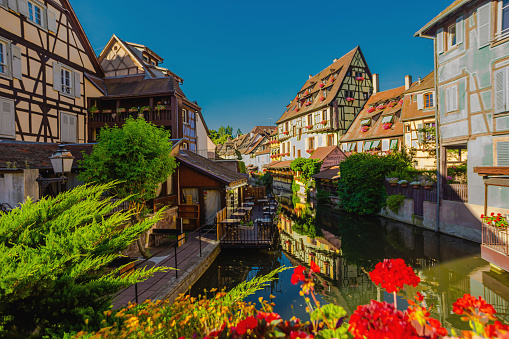 Alsace. Old ancient French city Colmar. Summer trip to France. European country. French architecture. Voyage. Warm sunny day. Travel destination. Street. Facade of houses.