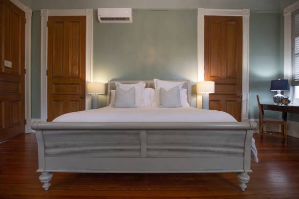 istock Bedroom with a king-size bed and white sheets inside a building in New Orleans 1439457092