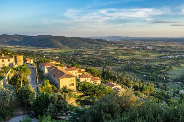 Panoramic view of Tuscany hills and village from Cortona, Arezzo province, Italy A panoramic view of Tuscany hills and village from Cortona, Arezzo province, Italy with the afternoon sunlight cortona stock pictures, royalty-free photos & images