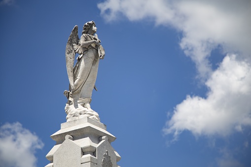 A beautiful shot of the religious statues with the blue sky in the background in New Orleans