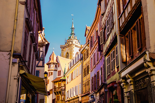 Alsace. Old ancient French city Colmar. Summer trip to France. European country. French architecture. Voyage. Warm sunny day. Travel destination. Street. Facade of houses.